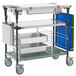 A white Metro PrepMate MultiStation with trays and baskets on wheels.