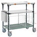 A Metro PrepMate MultiStation cart with a metal shelf and a tray on it.