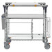 A Metro PrepMate Multistation cart with wheels and a shelf with wire shelving.