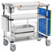 A Metro stainless steel cart with shelves and trays.