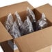 A box of six plastic bags of Mission Blue Triangle Corn Tortilla Chips.