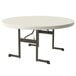 A Lifetime almond round plastic folding table with metal legs.