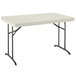 A white rectangular Lifetime plastic folding table with metal legs.