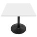 A white square Art Marble Furniture table top on a black metal base with a circular design.