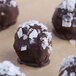 A group of chocolate balls with Regal Spanish sea salt flakes on top.