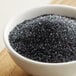 A bowl of black sanding sugar.