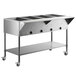 A stainless steel ServIt mobile electric steam table with undershelf.