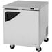 A small silver Turbo Air undercounter freezer with wheels.