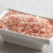A bowl of Regal Bulk Coarse Grain Pink Himalayan Salt on a table.