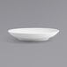 A white round porcelain low bowl with a spiral pattern.