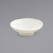 A white Front of the House ramekin with a spiral pattern.