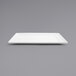 A white square Front of the House porcelain plate on a gray surface.
