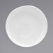 A white Front of the House porcelain plate with a rim on a gray surface.