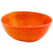 A Front of the House Kiln blood orange porcelain bowl with a white background.