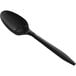 A black plastic teaspoon with a long handle.