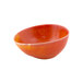A close-up of a white porcelain ramekin with a red and orange interior.