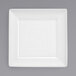A Front of the House white square porcelain plate with a square spiral design.