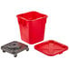 A red plastic Rubbermaid BRUTE trash can with a lid and wheels.