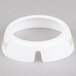 A white circular plastic collar with beige lettering and a hole in the center.
