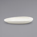 A close up of a white Front of the House porcelain oval plate.