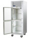 A Traulsen G Series reach-in refrigerator with open glass half doors.