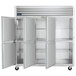 A Traulsen G Series reach-in refrigerator with open white doors.