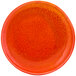 A close-up of a Front of the House Kiln blood orange porcelain plate with a white background.