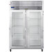 A Traulsen G Series reach-in refrigerator with two glass doors on a stainless steel cabinet.
