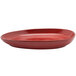 A red oval Front of the House Kiln porcelain plate.