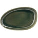 A green oval Front of the House Kiln porcelain plate with a dark brown rim.
