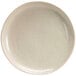 A white porcelain plate with black specks.