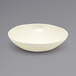 A Front of the House vanilla bean porcelain bowl on a gray background.