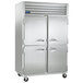 A large silver Traulsen G Series reach-in freezer with two doors.