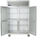 A Traulsen G Series reach-in freezer with open left and right doors.