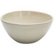 A white porcelain bowl with a speckled rim.