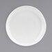 A close-up of a Front of the House Kiln Superwhite Porcelain Plate with a small rim.