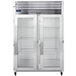 A large Traulsen reach-in refrigerator with two glass doors and shelves.