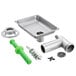 A stainless steel sink with a meat grinder attachment and stomper with green parts.