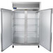 A white Traulsen G Series reach-in refrigerator with two doors and metal shelves.