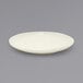 A white Front of the House Kiln porcelain plate with a small rim.