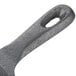 A close up of the handle of an American Metalcraft 4" Pre-Seasoned Mini Cast Iron Skillet.