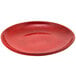 A red plate with a speckled surface.