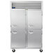 A Traulsen G Series reach-in refrigerator with metal half doors.