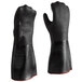 A pair of black San Jamar neoprene oven mitts with red trim.