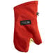 A red oven mitt with a black label.