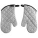 A pair of San Jamar silicone-coated oven mitts with black trim and white quilted fabric.