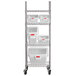 A Rubbermaid metal shelving unit with 5 white ingredient bins.
