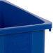 A blue Carlisle Trimline rectangular recycle bin with a lid.