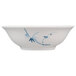 A white bowl with a blue bamboo design on the rim.