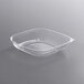A clear Fineline square plastic bowl with a lid.